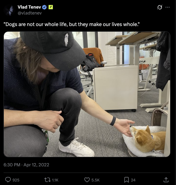 Vlad Tenev post showing a person petting a dog in an office